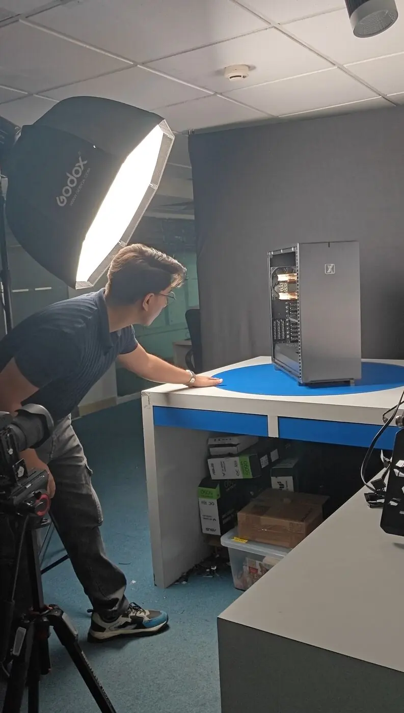 Divyansh setting up a workstation shoot at ProX PC